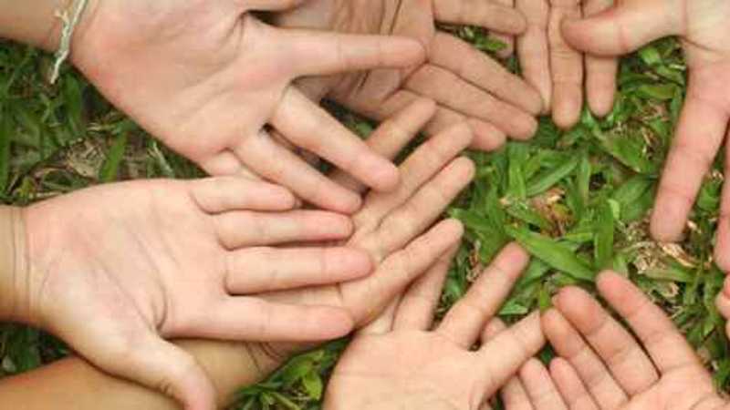 children's hands in a circle