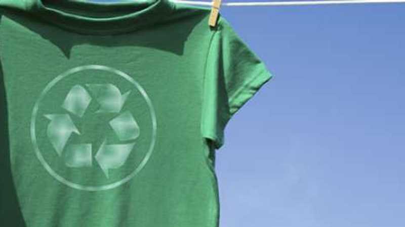 t-shirt hanging on a washing line with the recycling logo