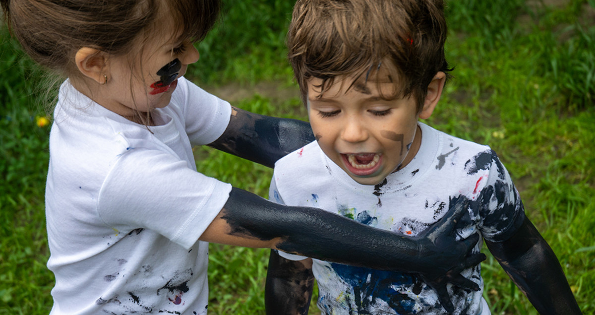 Children getting dirty together