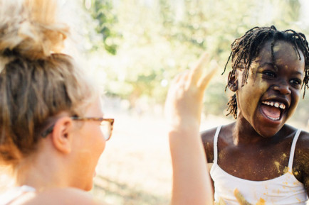 Girls playing with paint together