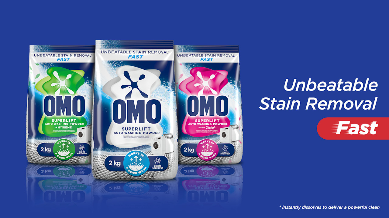 OMO auto powder range lined up on a blue background