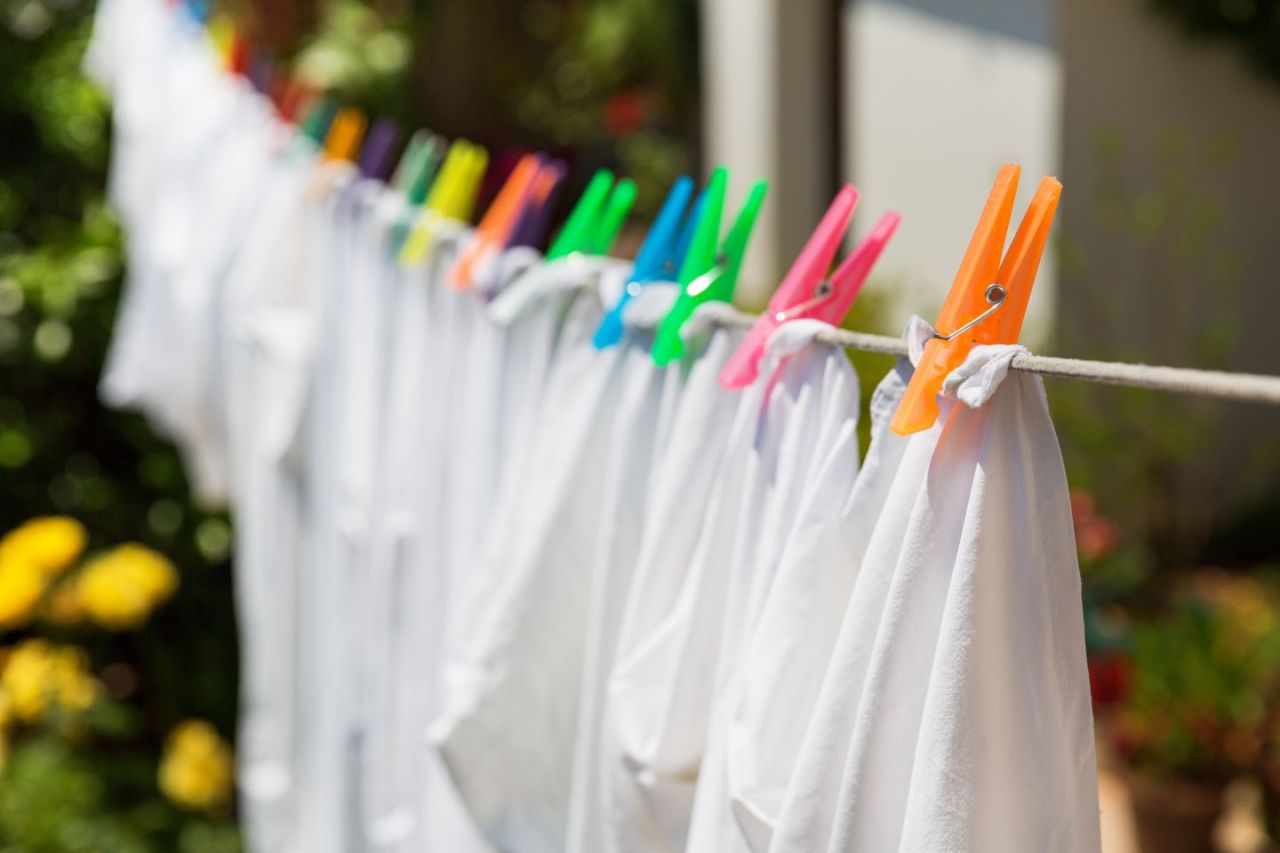 White clothes hung out to dry on the washing line.