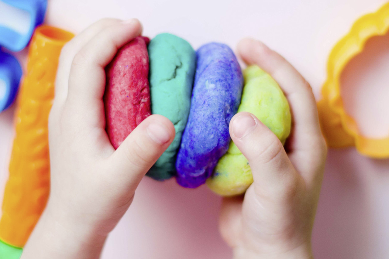 Person playing with play dough