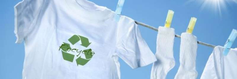 White t-shirt on washing line with socks and recycling logo