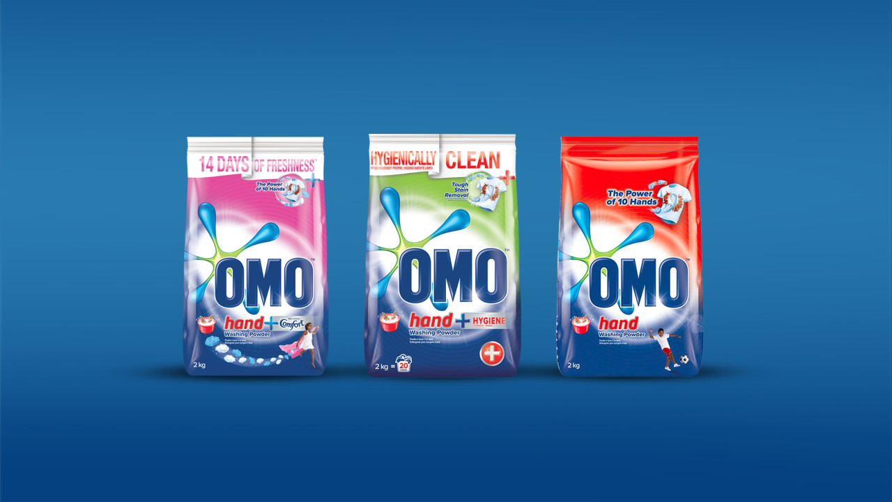 OMO hand wash powder range lined up on a blue background